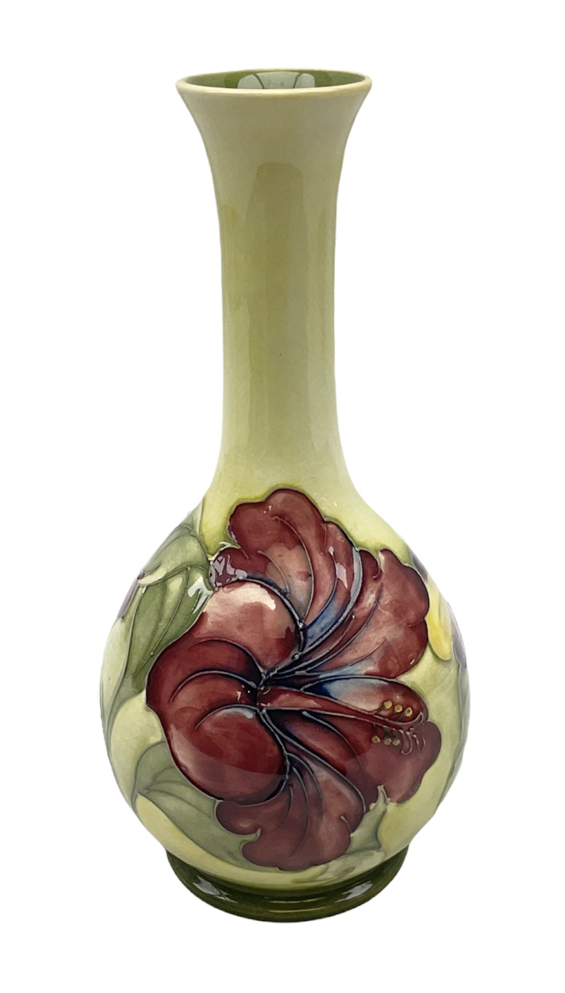 Moorcroft Hibiscus pattern vase of fluted form on a yellow ground