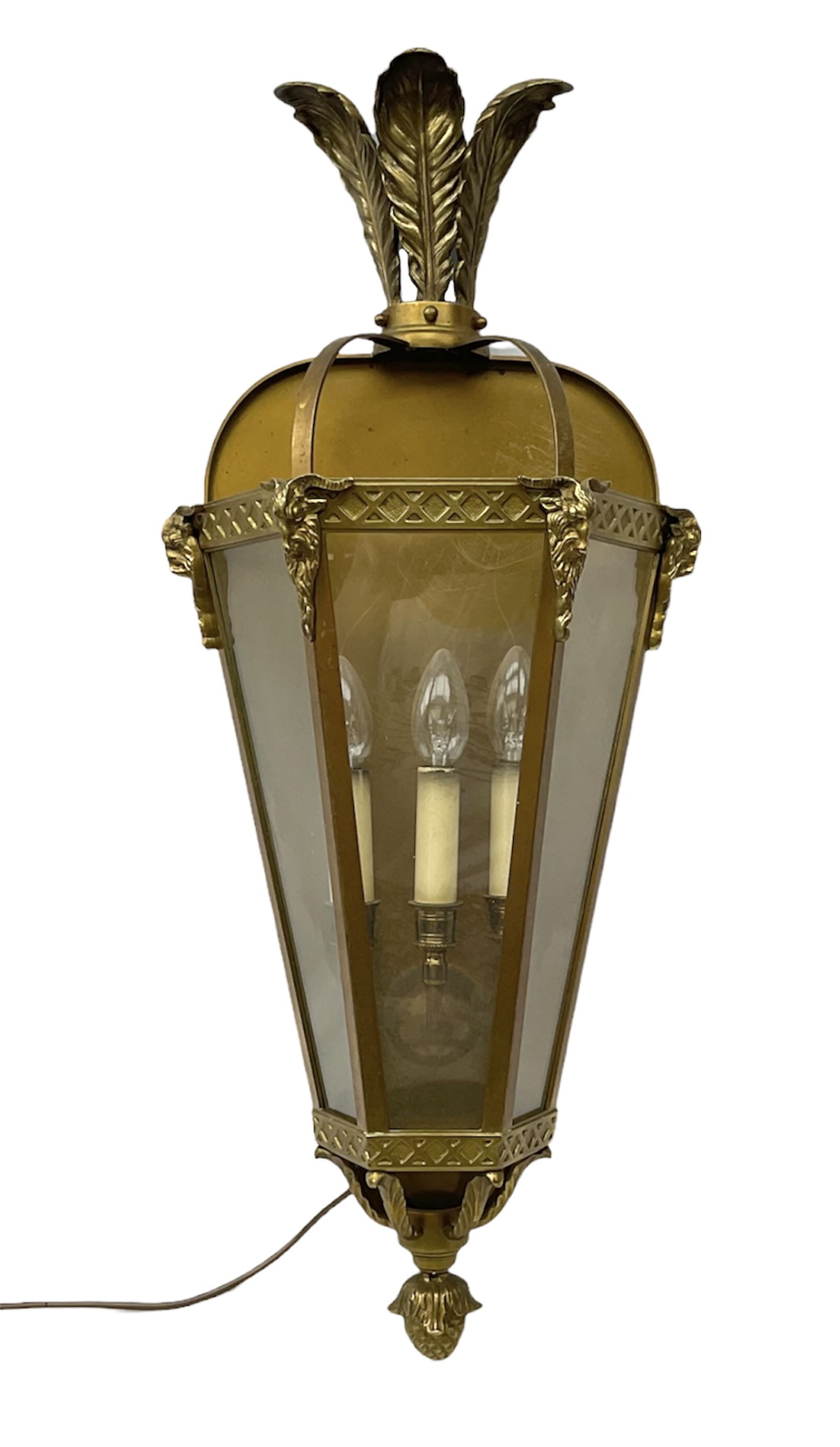 Brass and glass wall lantern of half hexagonal form and a three branch light fitting