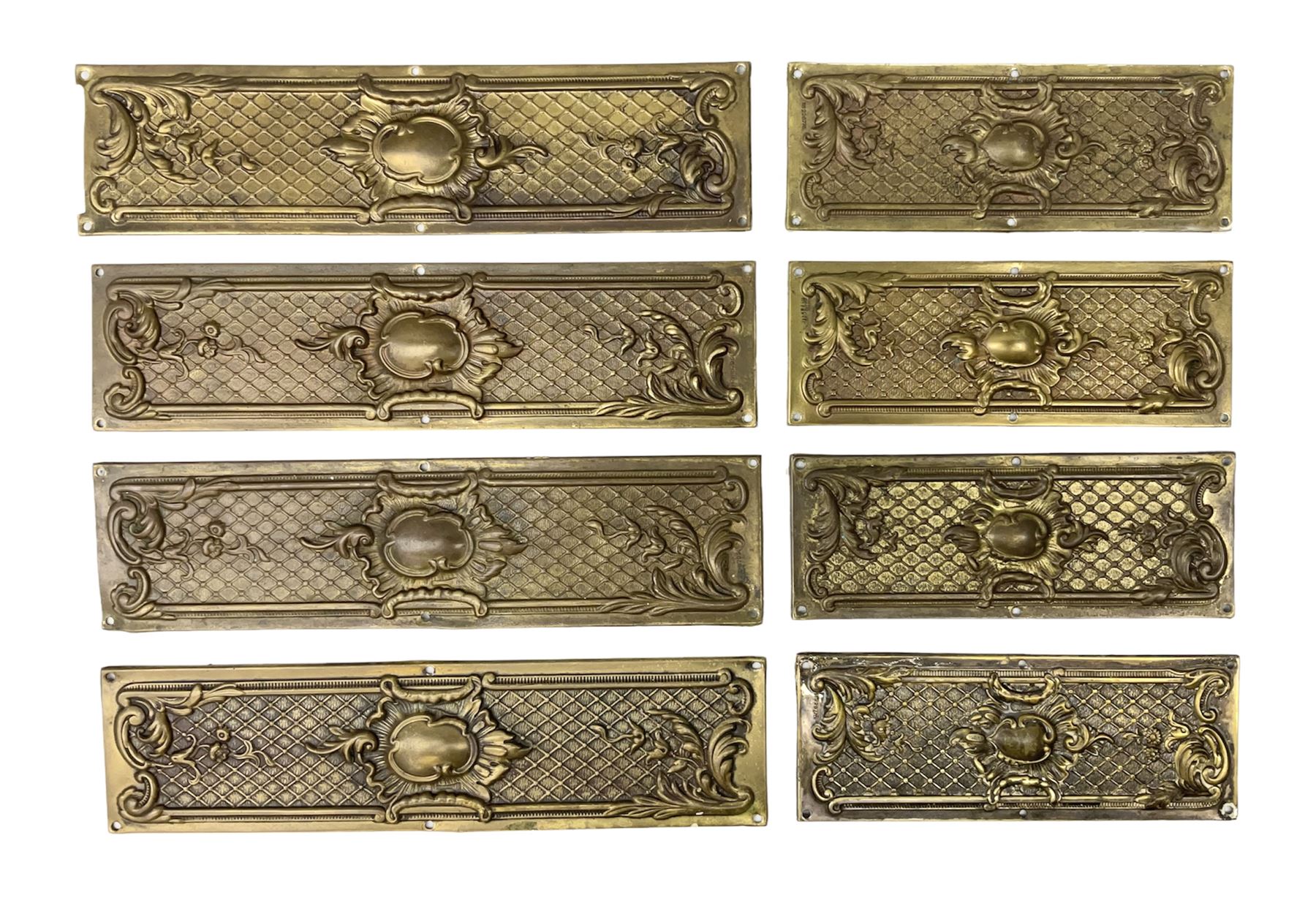 Two sets of four brass Art Nouveau finger plates