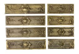 Two sets of four brass Art Nouveau finger plates