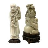 Two carved ivory figures