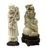 Two carved ivory figures