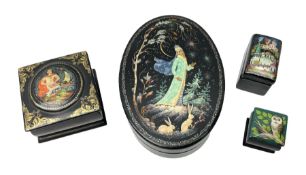 Four 20th century Russian lacquered and hand painted boxes
