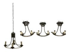 Gothic style iron chandelier with drip pans and twisted branches together with three matching twin w
