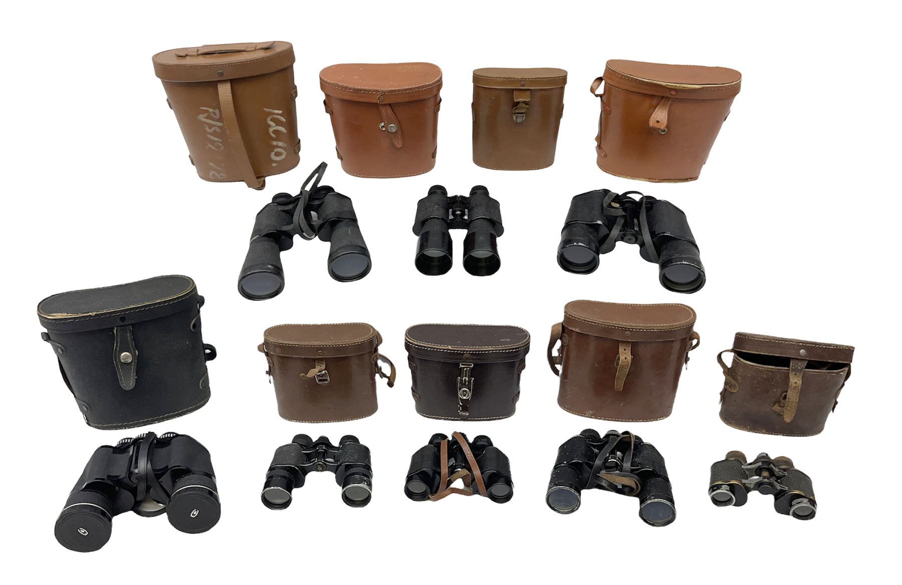 Eight cased pairs of binoculars