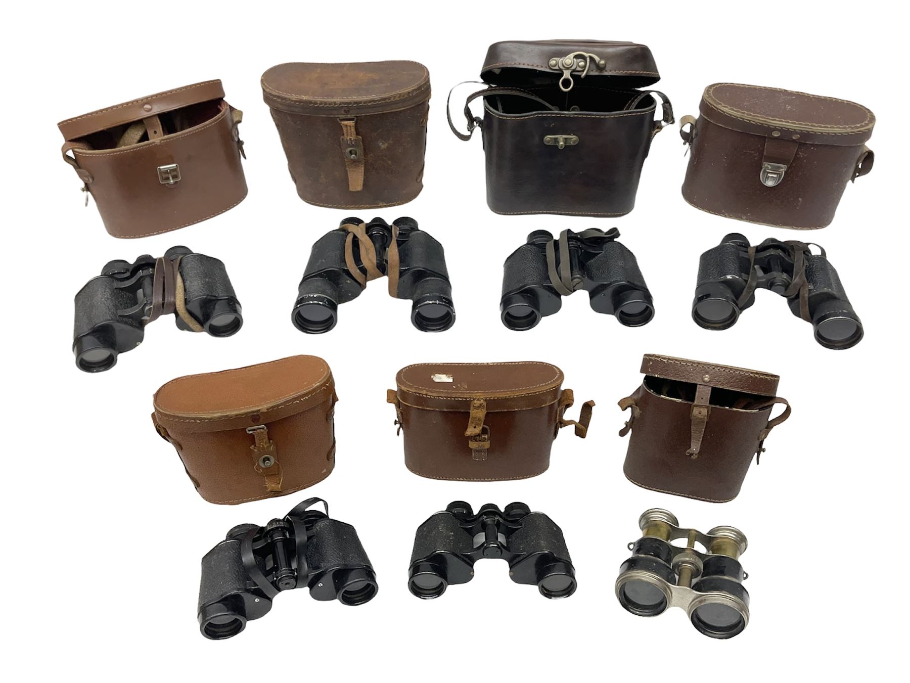 Seven cased pairs of binoculars