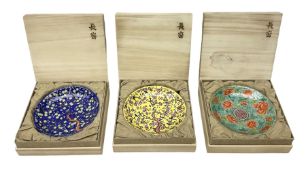 Three Chinese polychrome enamel plates each decorated with floral decoration