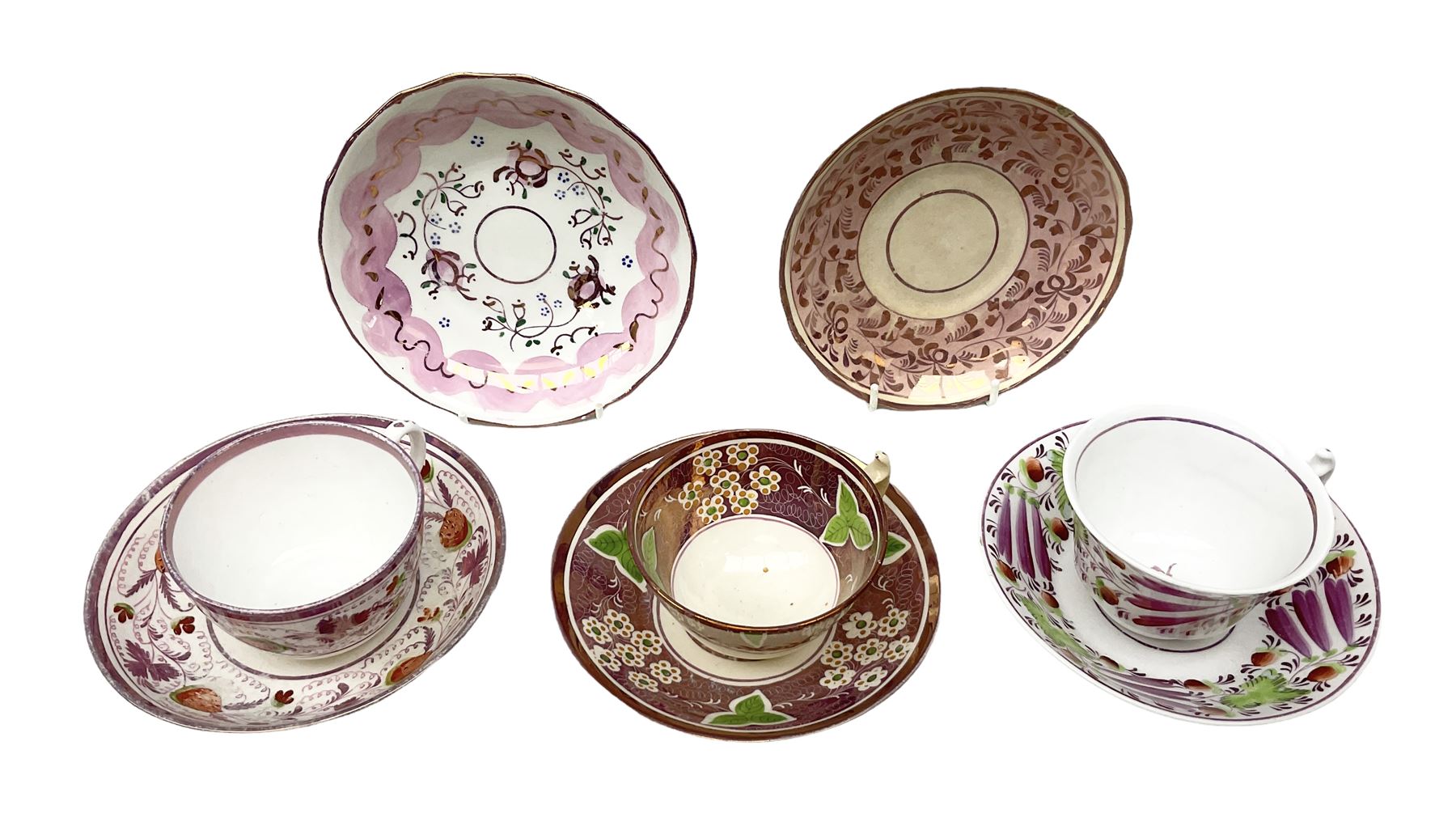 Three 19th century porcelain pink lustre teacups