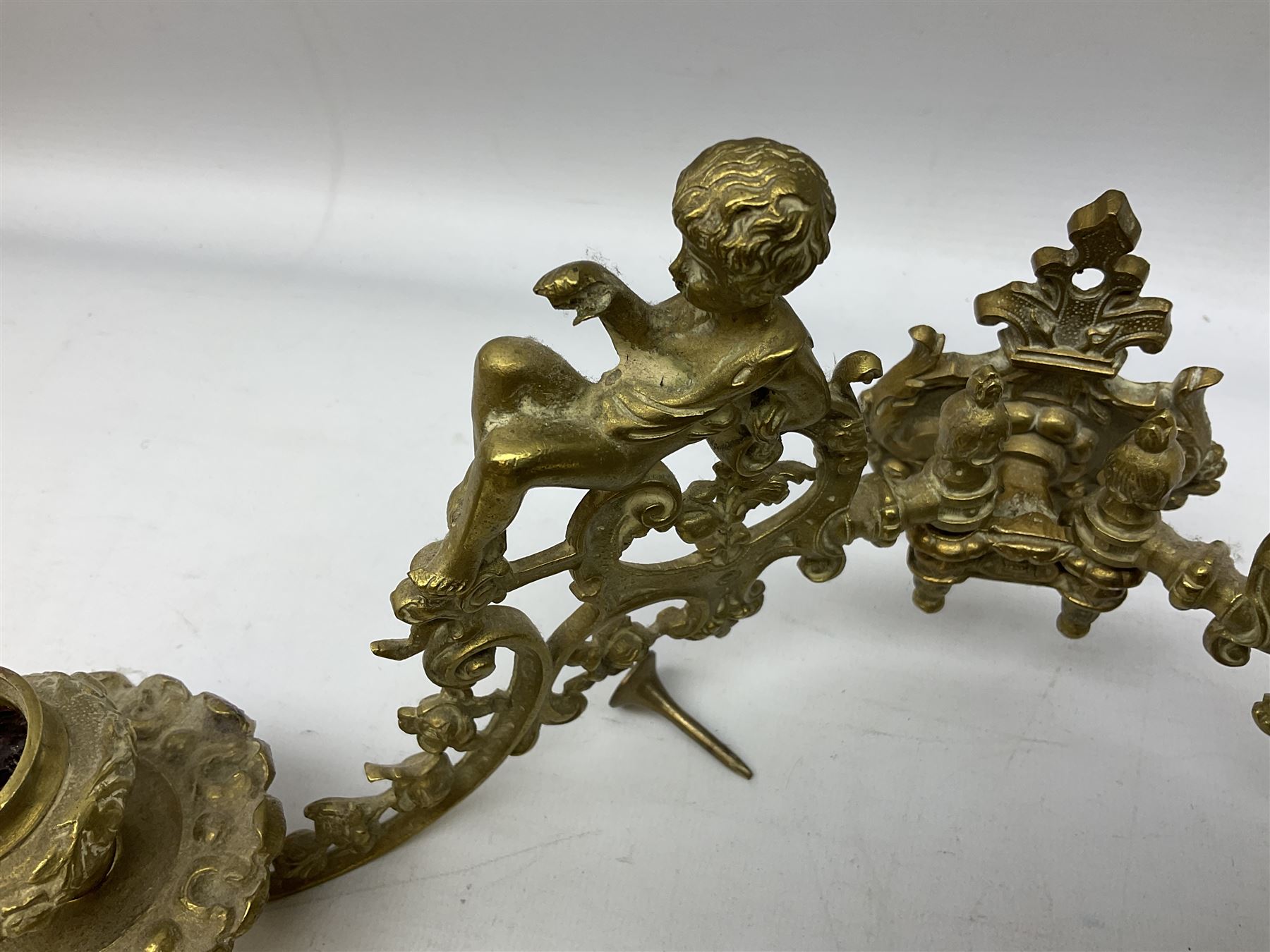 Two ornate brass wall sconces with twin branches modelled with cherubs playing trumpets - Image 2 of 5