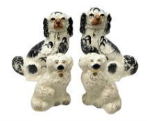 Pair of Beswick pottery chimney spaniels with painted faces and gilt collar chains