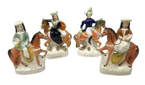 Pair of Staffordshire figures of children on horseback