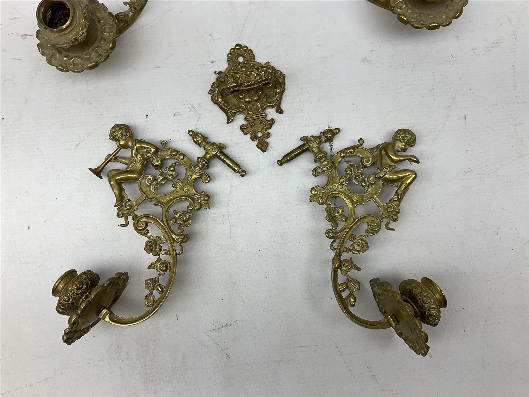 Two ornate brass wall sconces with twin branches modelled with cherubs playing trumpets - Image 3 of 5