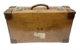 Vintage brown leather travel suitcase having studded leather corners with brass locks and catches an