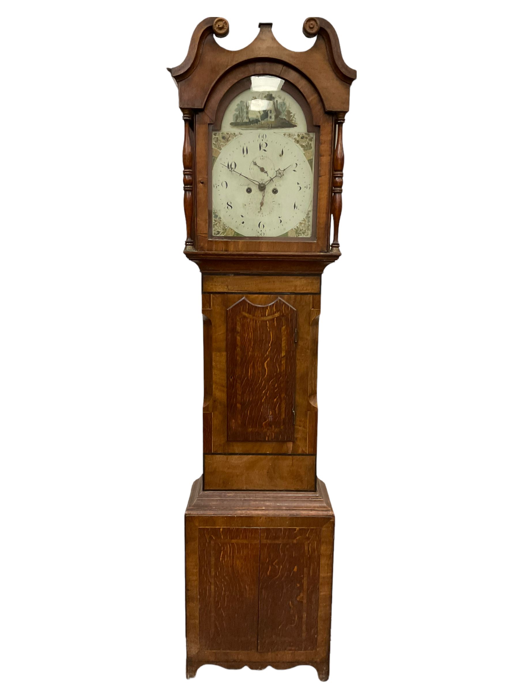 An Oak and Mahogany longcase clock with a Swans neck pediment and break arch hood door flanked by tw