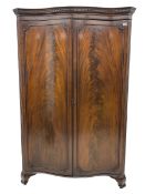 Early 20th century mahogany serpentine double wardrobe