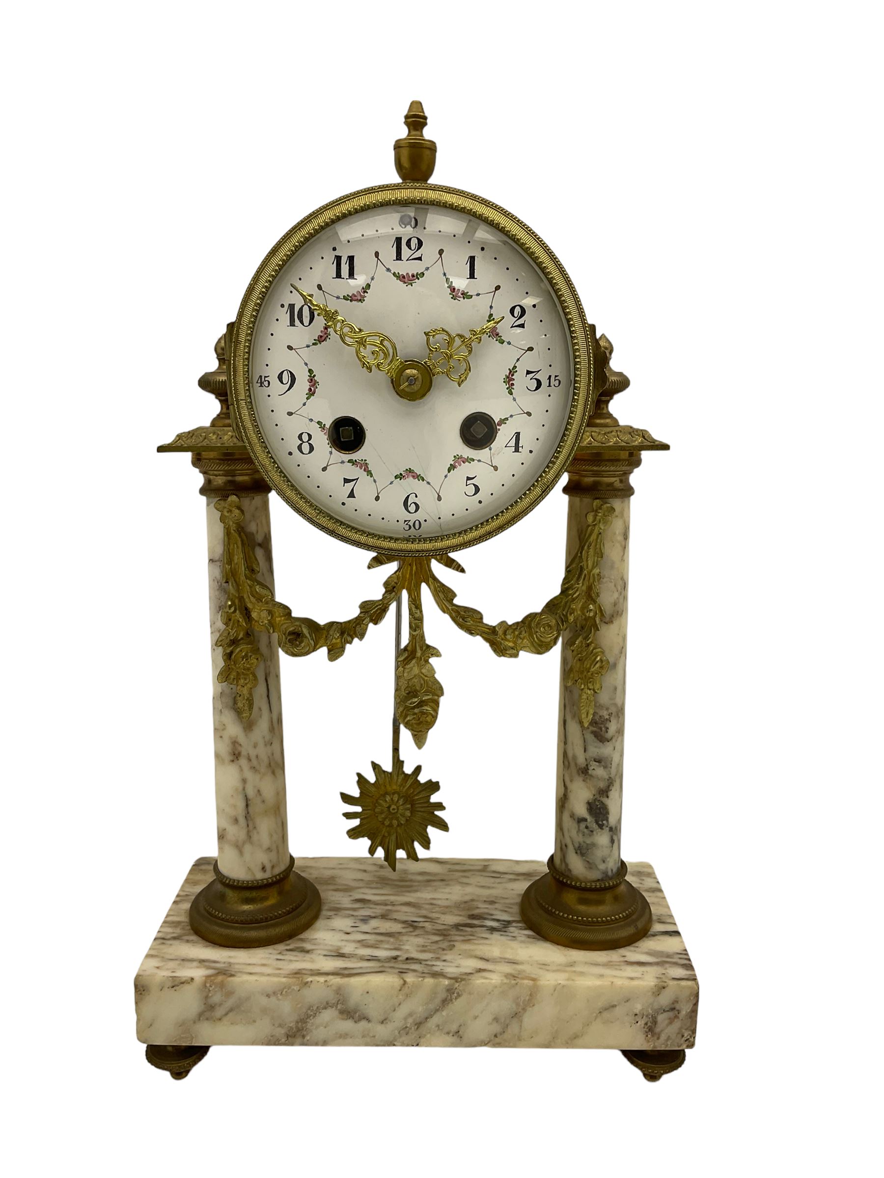 An early 20th century French portico clock c1910 with a gilt drum case raised on two variegated marb