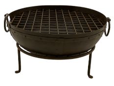 Wrought metal circular fire pit