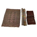 Three early Persian rugs and a saddle rug (4)