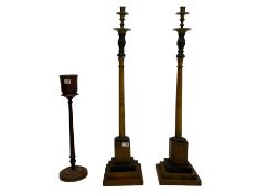 Pair of beech and ebonised wood candle stands