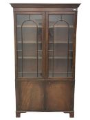 Late 19th century mahogany bookcase on cupboard