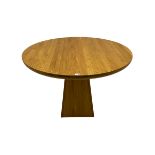 Light oak circular dining table