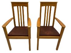 Pair of solid oak Arts and Crafts style carver chairs