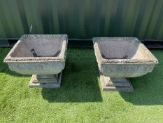 Pair of composite stone garden urns