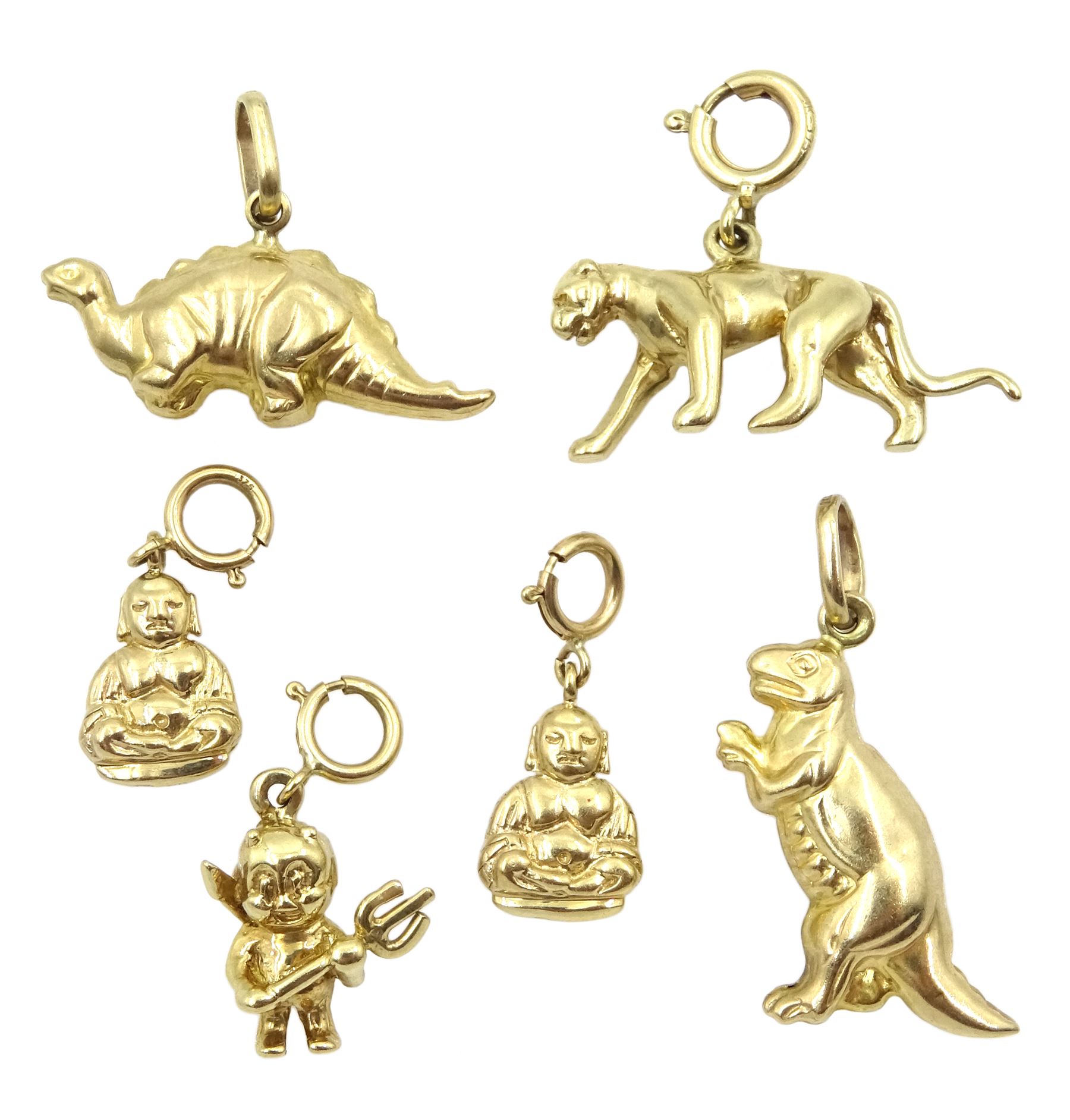 Six 9ct gold charms including two dinosaurs