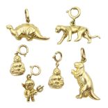 Six 9ct gold charms including two dinosaurs
