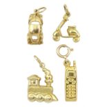 Four gold charms including car