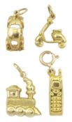 Four gold charms including car