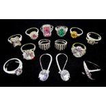 Ten silver stone set dress rings and two pairs of silver stone set earrings