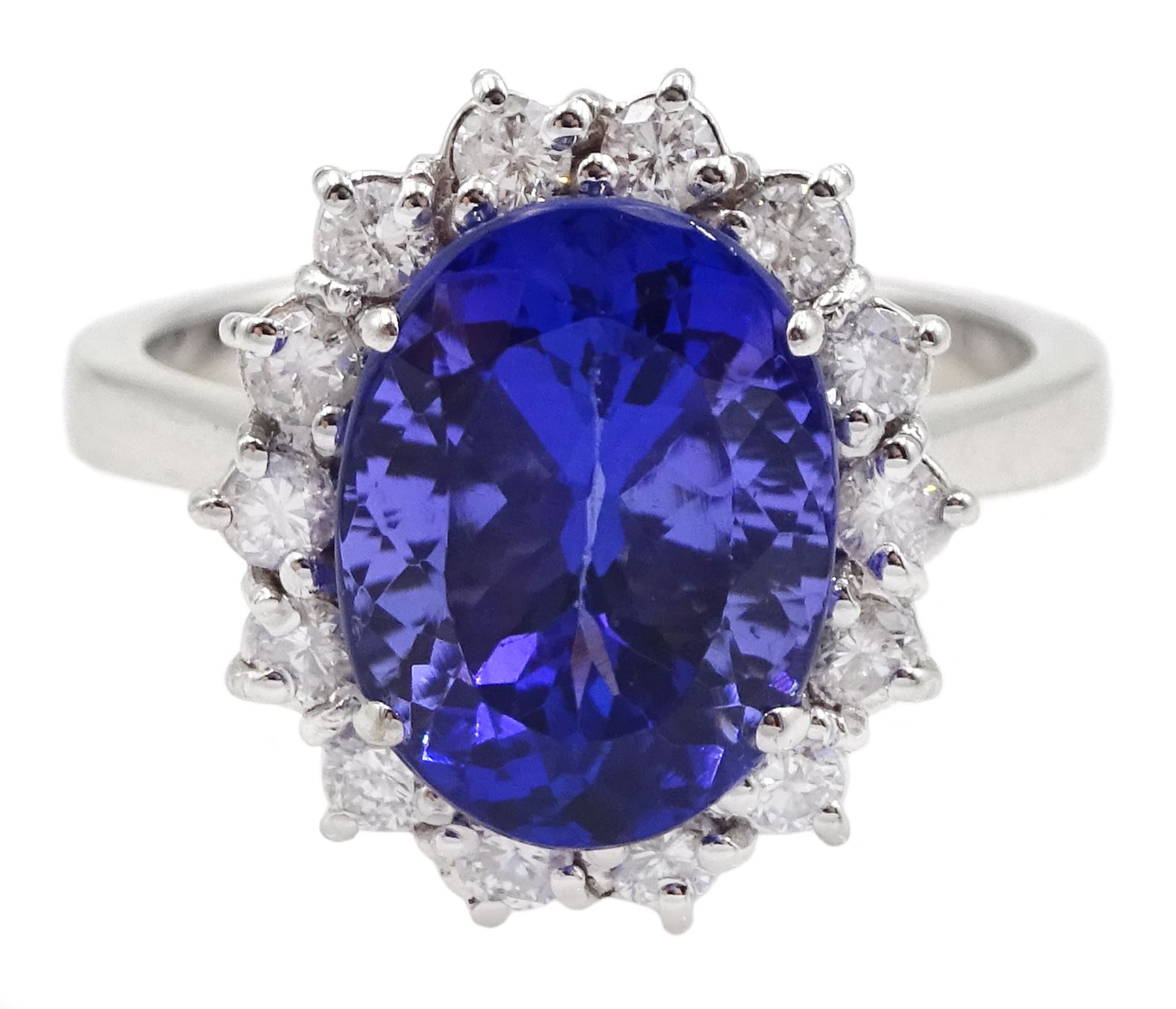 18ct white gold oval tanzanite and round brilliant cut diamond cluster ring