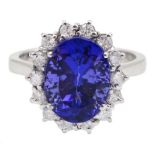 18ct white gold oval tanzanite and round brilliant cut diamond cluster ring