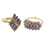 Gold tanzanite marquise shaped cross over ring and a gold three row tanzanite ring