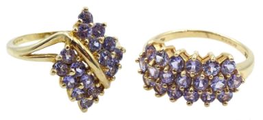 Gold tanzanite marquise shaped cross over ring and a gold three row tanzanite ring