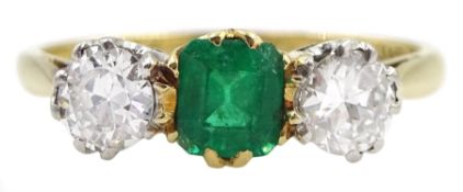 Early 20th century gold three stone old cut diamond and emerald ring