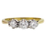 Gold three stone round brilliant cut diamond ring