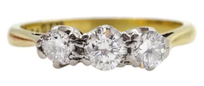 Gold three stone round brilliant cut diamond ring