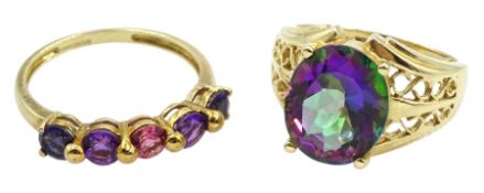 Gold oval mystic topaz ring with pierced shoulders and a gold five stone iolite