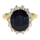 18ct gold oval sapphire and round brilliant cut diamond cluster ring