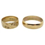 Gold wedding band with engraved decoration and one other