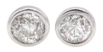 Pair of 18ct white gold bezel set old cut diamond stud earrings