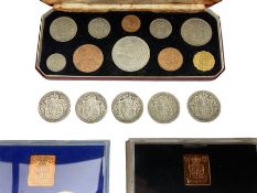 Four King George V 1915 and one 1916 silver halfcrown coins