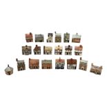 Twenty studio pottery figures of houses and cottages