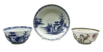 Nanking Cargo blue and white tea bowl and saucer decorated in scene with pagoda in riverscape