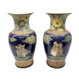Pair of oriental floor vases of baluster form