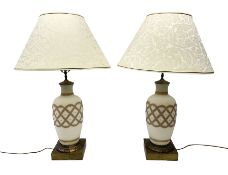 Pair of milk glass lamps of baluster form