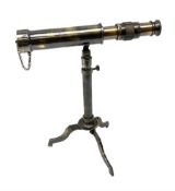 Modern table top telescope on folding tripod base