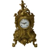 A 20th century Italian striking mantle clock in a brass case in the late 18th century Rocco style